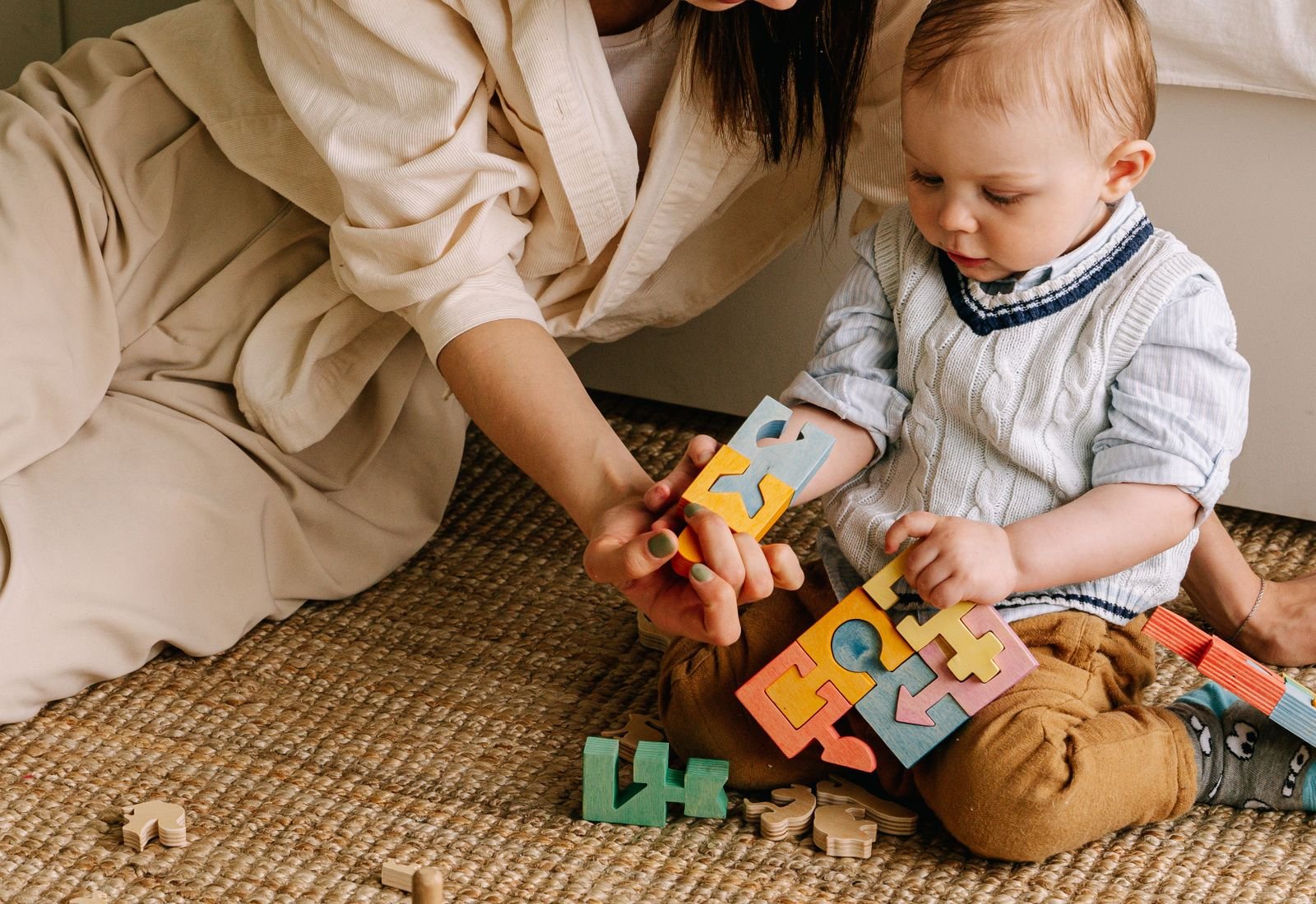 A parent and child playing together during a session